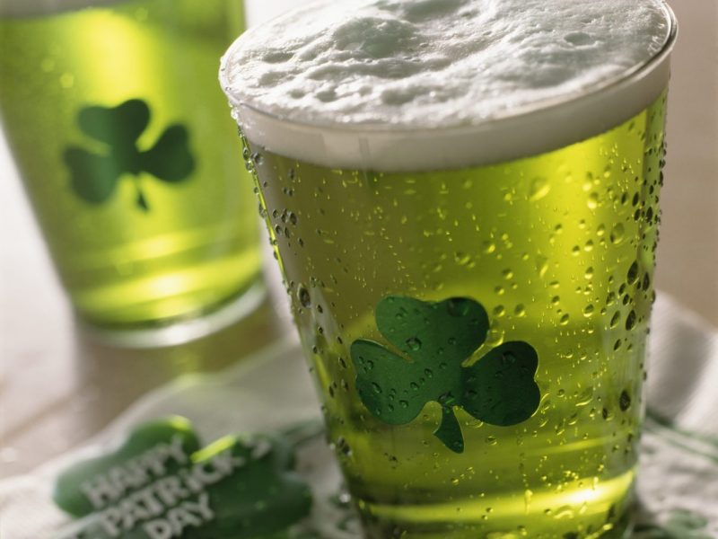 Close up of beverages with shamrocks on glass