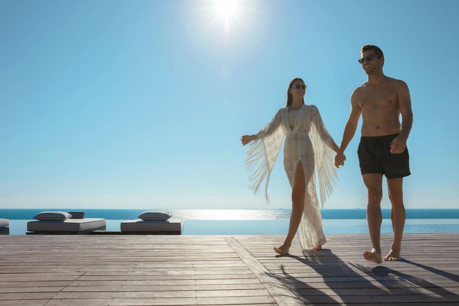 Couple walking by the pool