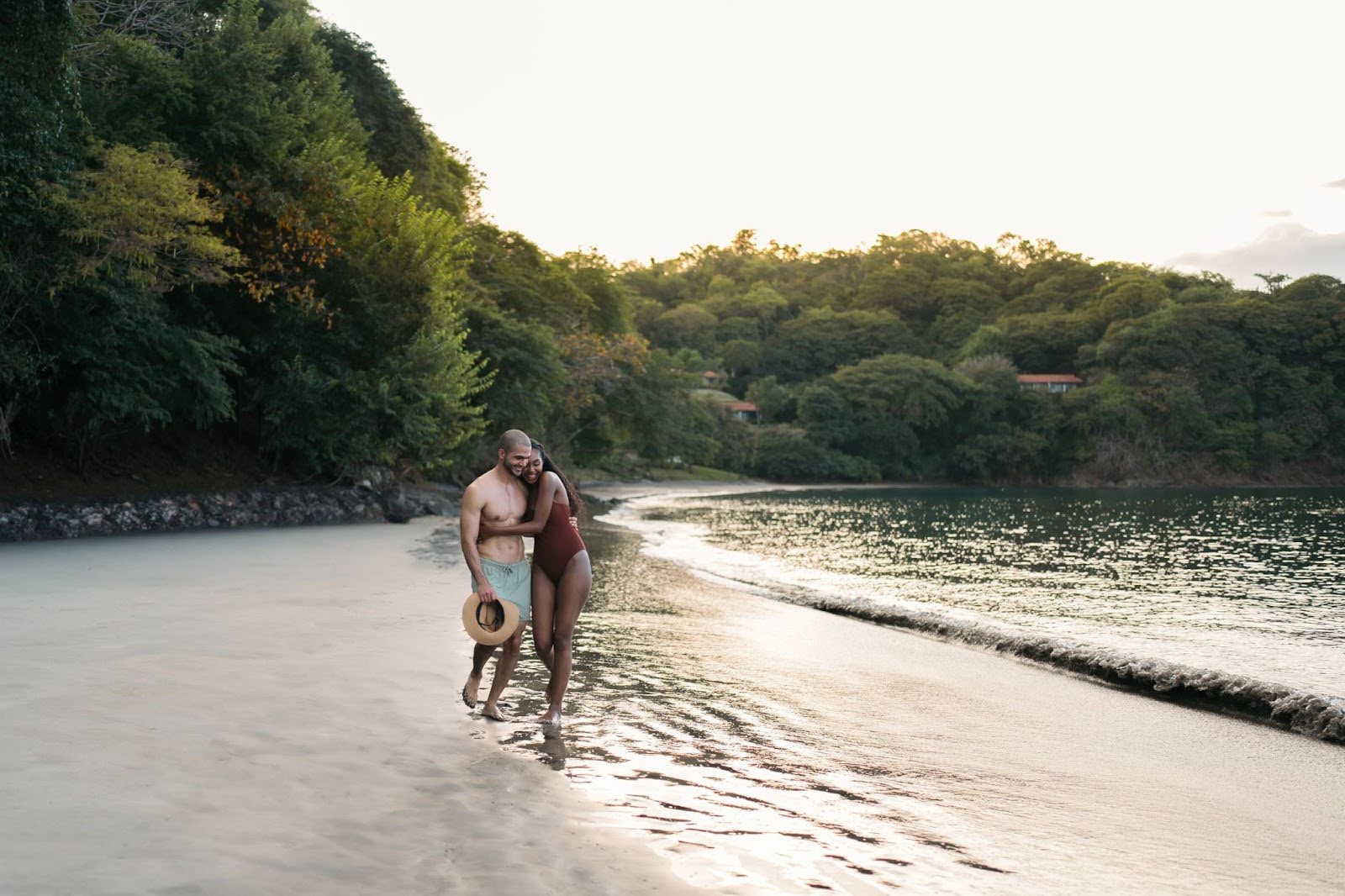 Couple walking on a deserted beach