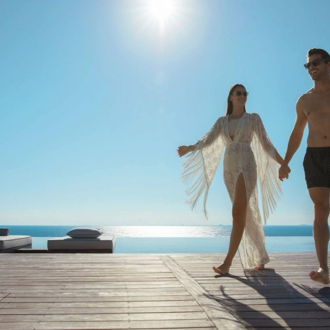 Couple walking by the pool