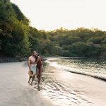 Couple walking on a deserted beach