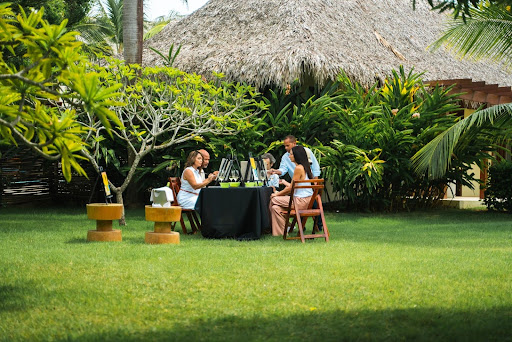 Group of people painting at the garden