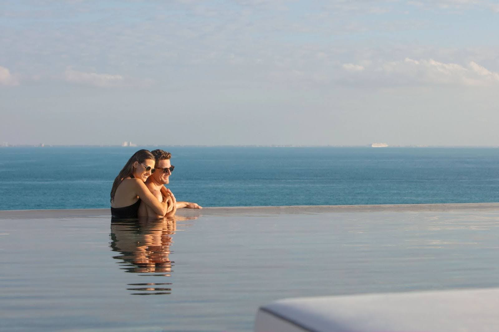 Couple at a rooftop infinity pool