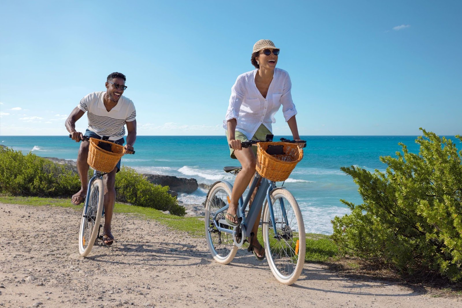 Couple bike riding by the beach