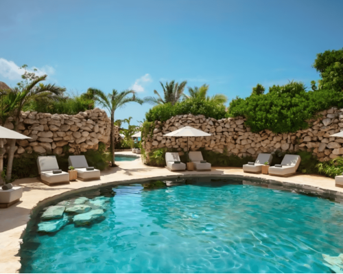 cenote pool surrounded by lounge chairs, palm trees and stone walls secrets moxché playa del carmen