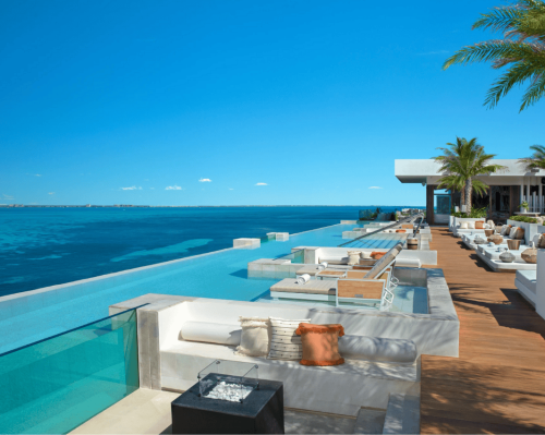 oceanfront infinity pool with modern lounge area and panoramic view impression isla mujeres by secrets