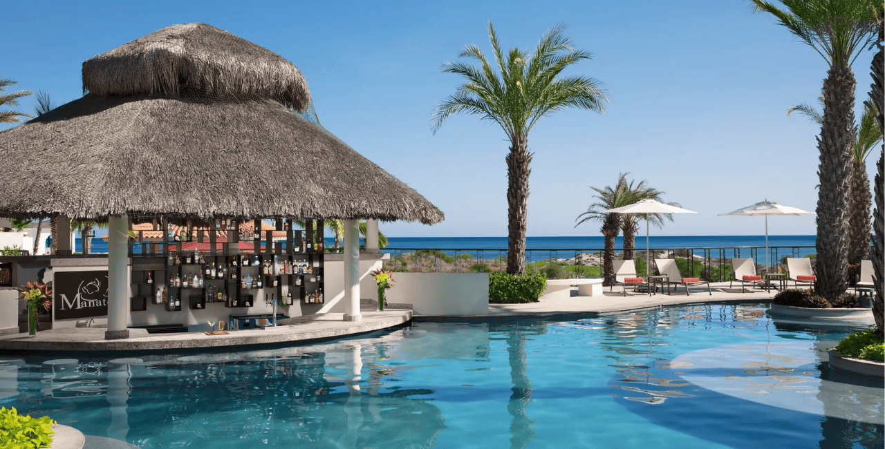 lounge chairs on white sand facing the sea secrets akumal riviera maya