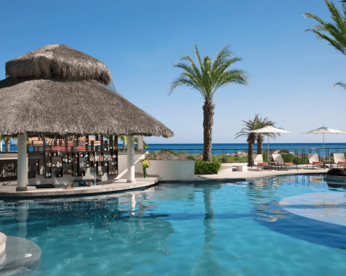 lounge chairs on white sand facing the sea secrets akumal riviera maya