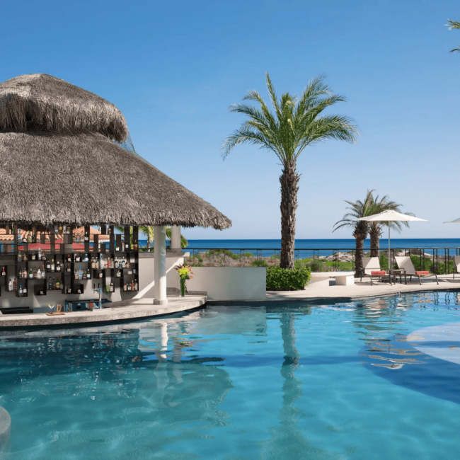 lounge chairs on white sand facing the sea secrets akumal riviera maya