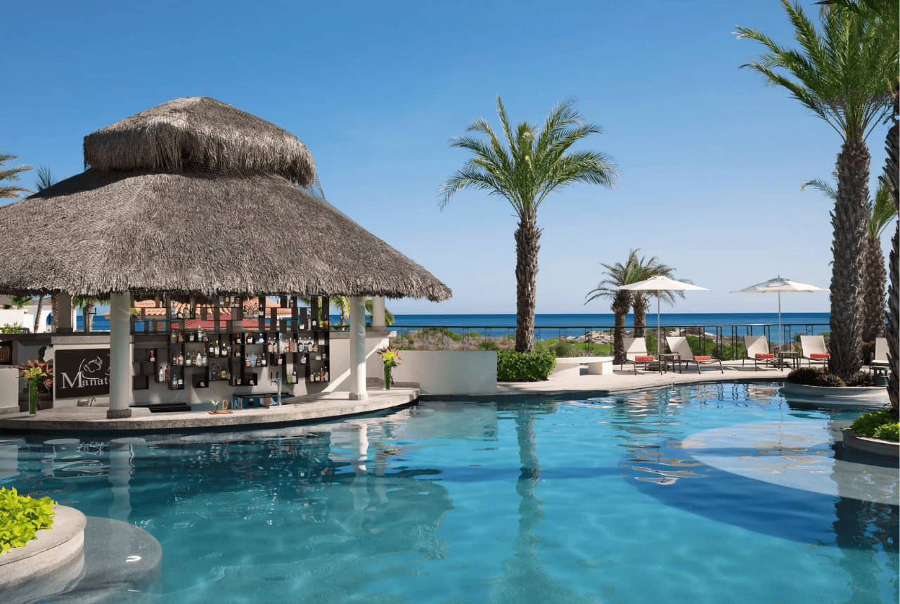 lounge chairs on white sand facing the sea secrets akumal riviera maya