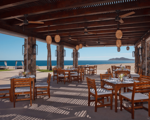 beachfront outdoor restaurant with wooden tables and ocean view zoëtry casa del mar los cabos