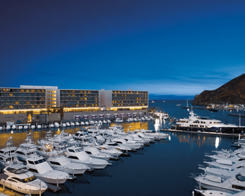 luxury marina with yachts and oceanfront resort at twilight breathless cabo san lucas resort & spa